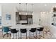 Open concept kitchen with island and stainless steel appliances at 3630 N Davidson St # 4413, Charlotte, NC 28205