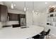 Modern kitchen with dark cabinetry and breakfast bar at 3630 N Davidson St # 4413, Charlotte, NC 28205