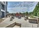 Spacious patio with comfortable seating and umbrellas at 3630 N Davidson St # 4413, Charlotte, NC 28205