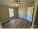 Bright bedroom with wood-look floors and ceiling fan at 4665 Mount Carmel Rd, Heath Springs, SC 29058