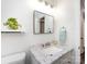 Well-lit bathroom featuring white walls, white sink, and granite countertops at 4837 Holbrook Dr, Charlotte, NC 28212