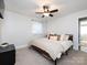 Bedroom with neutral carpet and walls, ceiling fan, and a window for natural light at 4837 Holbrook Dr, Charlotte, NC 28212