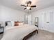 Spacious bedroom featuring neutral carpet and walls, ceiling fan, closet, and bedside table at 4837 Holbrook Dr, Charlotte, NC 28212