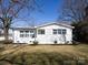Attractive home featuring well-kept landscaping and a freshly painted exterior at 4837 Holbrook Dr, Charlotte, NC 28212
