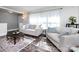 Comfortable living area filled with natural light, modern decor and sleek hardwood floors at 4837 Holbrook Dr, Charlotte, NC 28212