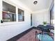 Cozy sunroom with brick walls and large windows, perfect for relaxing at 4837 Holbrook Dr, Charlotte, NC 28212