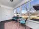 Bright sunroom with large windows and comfortable seating, offering serene views at 4837 Holbrook Dr, Charlotte, NC 28212