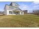 Expansive backyard featuring a covered patio, ideal for outdoor gatherings at 6124 Music Arbor Ln, Huntersville, NC 28078