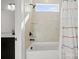Bright bathroom featuring a tiled shower-tub combination and modern fixtures at 6124 Music Arbor Ln, Huntersville, NC 28078