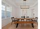 Elegant dining room with modern lighting and a large window at 6124 Music Arbor Ln, Huntersville, NC 28078