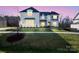 Charming two-story home with manicured lawn and classic architectural details at 6124 Music Arbor Ln, Huntersville, NC 28078