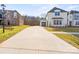 Spacious driveway leading to a well-maintained home and detached garage at 6124 Music Arbor Ln, Huntersville, NC 28078