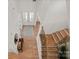 Upstairs view of the stylish foyer with hardwood floors and staircase at 6124 Music Arbor Ln, Huntersville, NC 28078