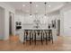 Open kitchen features a large island, stainless appliances, and ample counter space at 6124 Music Arbor Ln, Huntersville, NC 28078