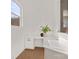 Bright office nook with white cabinetry, quartz countertops, and modern decor, offering a stylish workspace at 6124 Music Arbor Ln, Huntersville, NC 28078