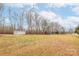 Large backyard with trees and sheds at 684 Hatchett Rd, Lincolnton, NC 28092