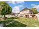 Landscaped backyard with a large grassy area and shed at 8244 Fox Swamp Rd, Charlotte, NC 28215