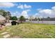 Large backyard with grassy area, trampoline and swing set at 8244 Fox Swamp Rd, Charlotte, NC 28215