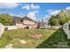 Large backyard with grassy area, playground set, and fire pit at 8244 Fox Swamp Rd, Charlotte, NC 28215