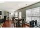 Bright breakfast area with a round table and chairs, hardwood floors, and built-in shelving at 8244 Fox Swamp Rd, Charlotte, NC 28215