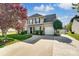 Two-story house with a landscaped lawn and driveway at 8244 Fox Swamp Rd, Charlotte, NC 28215
