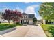 Two-story house with a landscaped lawn and driveway at 8244 Fox Swamp Rd, Charlotte, NC 28215
