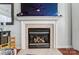 Gas fireplace with a tile surround and mantel at 8244 Fox Swamp Rd, Charlotte, NC 28215