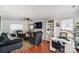 Living room with fireplace, seating, and a workspace at 8244 Fox Swamp Rd, Charlotte, NC 28215