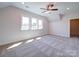 Spacious bonus room with carpet and multiple windows at 0000 Trull Hinson Rd, Wingate, NC 28174