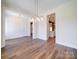 Bright dining room with hardwood floors and views into the kitchen at 0000 Trull Hinson Rd, Wingate, NC 28174