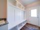 Laundry room with built-in storage, a granite countertop, and a door to the outside at 0000 Trull Hinson Rd, Wingate, NC 28174