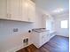 Laundry room with white cabinets, granite countertop and built in storage at 0000 Trull Hinson Rd, Wingate, NC 28174