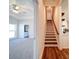 Wooden staircase with hardwood floors and a view into a living area at 0000 Trull Hinson Rd, Wingate, NC 28174