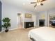 Main bedroom with access to bathroom, dresser and ceiling fan at 1021 Glen Laurel Dr, Fort Mill, SC 29707