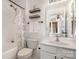 Bathroom with white vanity, shower, and patterned curtain at 10463 Alexander Martin Ave, Charlotte, NC 28277