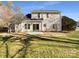 Large backyard with patio and mature trees at 11006 Renoir Ct, Charlotte, NC 28215