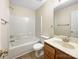 Bathroom with shower/tub combo and wood vanity at 11006 Renoir Ct, Charlotte, NC 28215