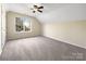 Spacious bedroom with ceiling fan and carpeting at 11006 Renoir Ct, Charlotte, NC 28215