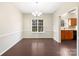 Formal dining area with hardwood floors and view to kitchen at 11006 Renoir Ct, Charlotte, NC 28215