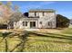 Two-story house back view, showcasing a patio and well-maintained lawn at 11006 Renoir Ct, Charlotte, NC 28215