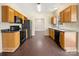 Kitchen with dark countertops and wood cabinets at 11006 Renoir Ct, Charlotte, NC 28215