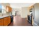 Kitchen with wood cabinets, and view to living room at 11006 Renoir Ct, Charlotte, NC 28215
