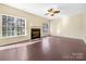 Living room featuring hardwood floors and a fireplace at 11006 Renoir Ct, Charlotte, NC 28215