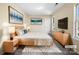 Virtually staged main bedroom with large bed and dresser at 11006 Renoir Ct, Charlotte, NC 28215