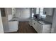 Renovated kitchen featuring granite countertops and white cabinets at 1125 Forestdale Dr, Salisbury, NC 28144