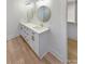 Double vanity bathroom with modern white cabinets and gold fixtures at 1201 Pierson Dr, Charlotte, NC 28205