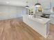 Eat-in kitchen featuring white cabinets, quartz countertops, and a spacious island at 1201 Pierson Dr, Charlotte, NC 28205