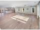 Open concept living space with hardwood floors and kitchen views at 1201 Pierson Dr, Charlotte, NC 28205