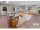 Bright and airy living room with hardwood floors and large windows at 1201 Pierson Dr, Charlotte, NC 28205