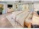 Main bedroom with hardwood floors and sliding barn doors to en suite at 1201 Pierson Dr, Charlotte, NC 28205